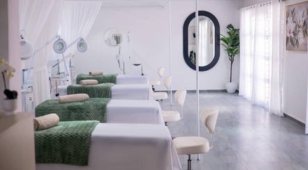 Relaxing treatment room at Micata Facial Bar, Lusaka, Lusaka Province, ZM with spa beds and soft lighting.