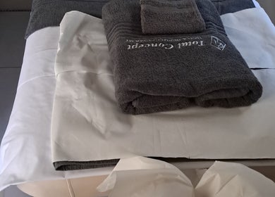 Soft towels on a massage bed at Kayises Beauty and Wellness Spa in East London, Eastern Cape, ZA.