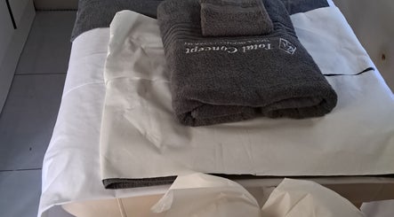 Soft towels on a massage bed at Kayises Beauty and Wellness Spa in East London, Eastern Cape, ZA.