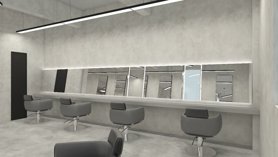 Stylish salon interior at Yoje, Kuala Lumpur, Wilayah Persekutuan Kuala Lumpur, MY with sleek chairs and mirrors.