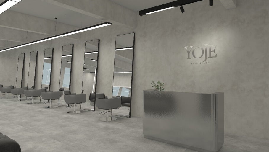 Chic interior of Yoje salon in Kuala Lumpur, featuring sleek chairs and elegant mirrors.