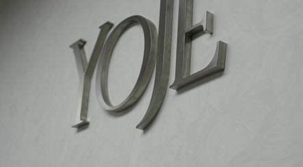 Yoje Hair Salon metal sign on textured wall in Kuala Lumpur, Wilayah Persekutuan Kuala Lumpur, MY.