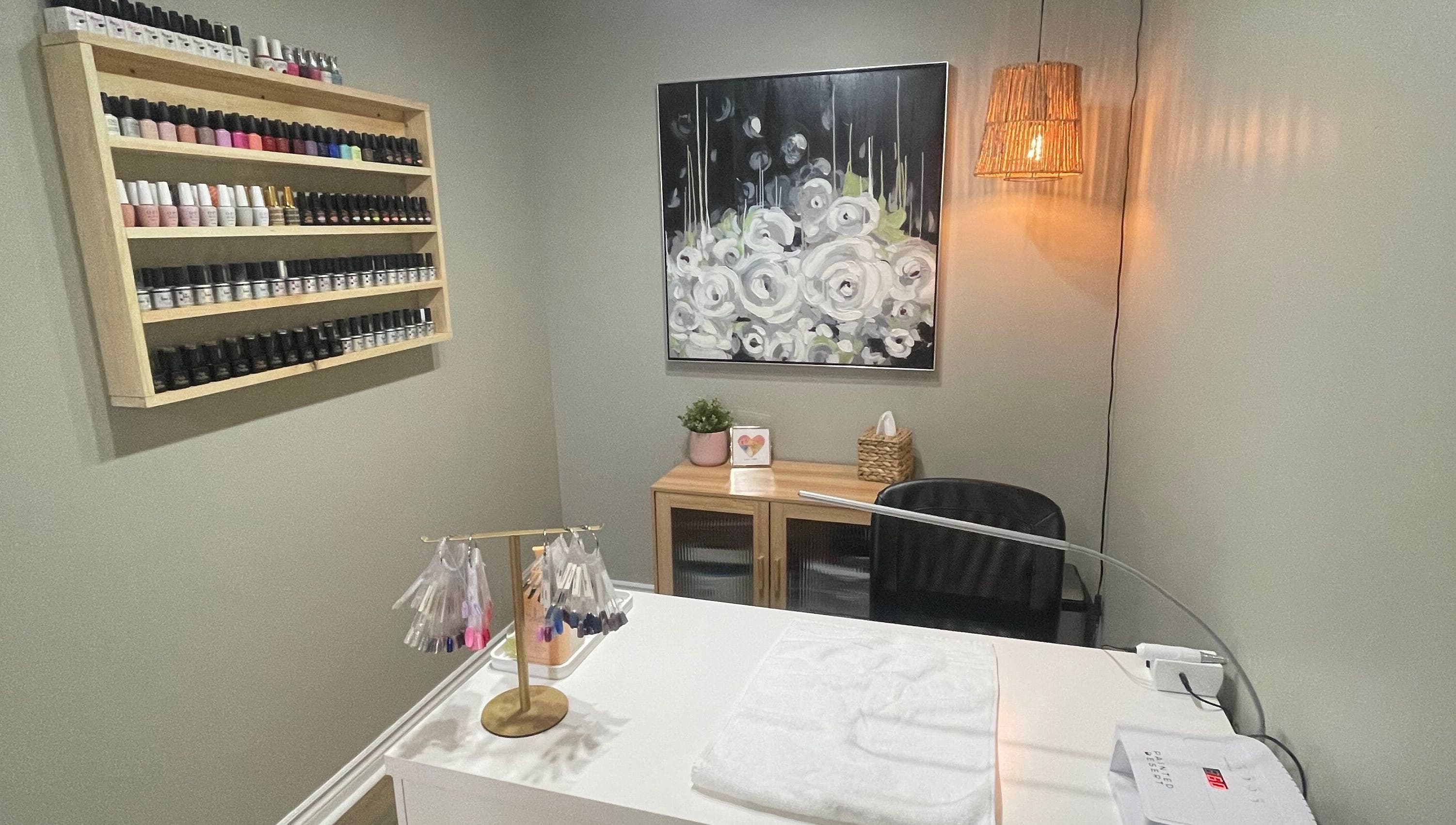 Nail salon at Chelseas Esthetics in Sydney Mines, Nova Scotia, CA featuring polish display and modern décor.