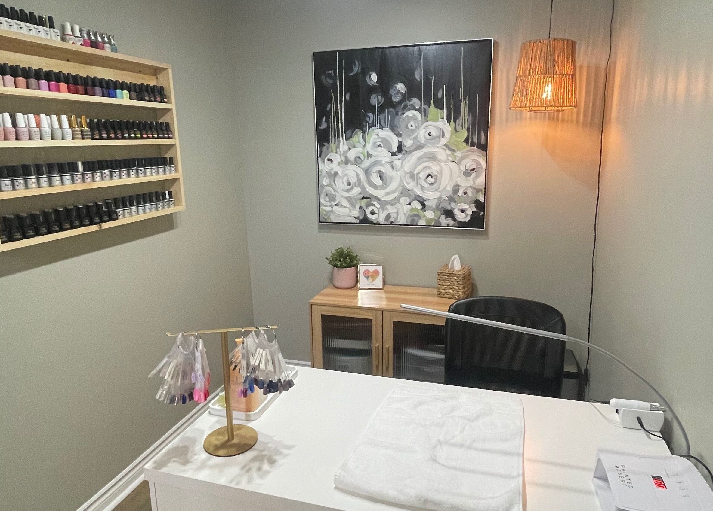 Nail salon at Chelseas Esthetics in Sydney Mines, Nova Scotia, CA featuring polish display and modern décor.