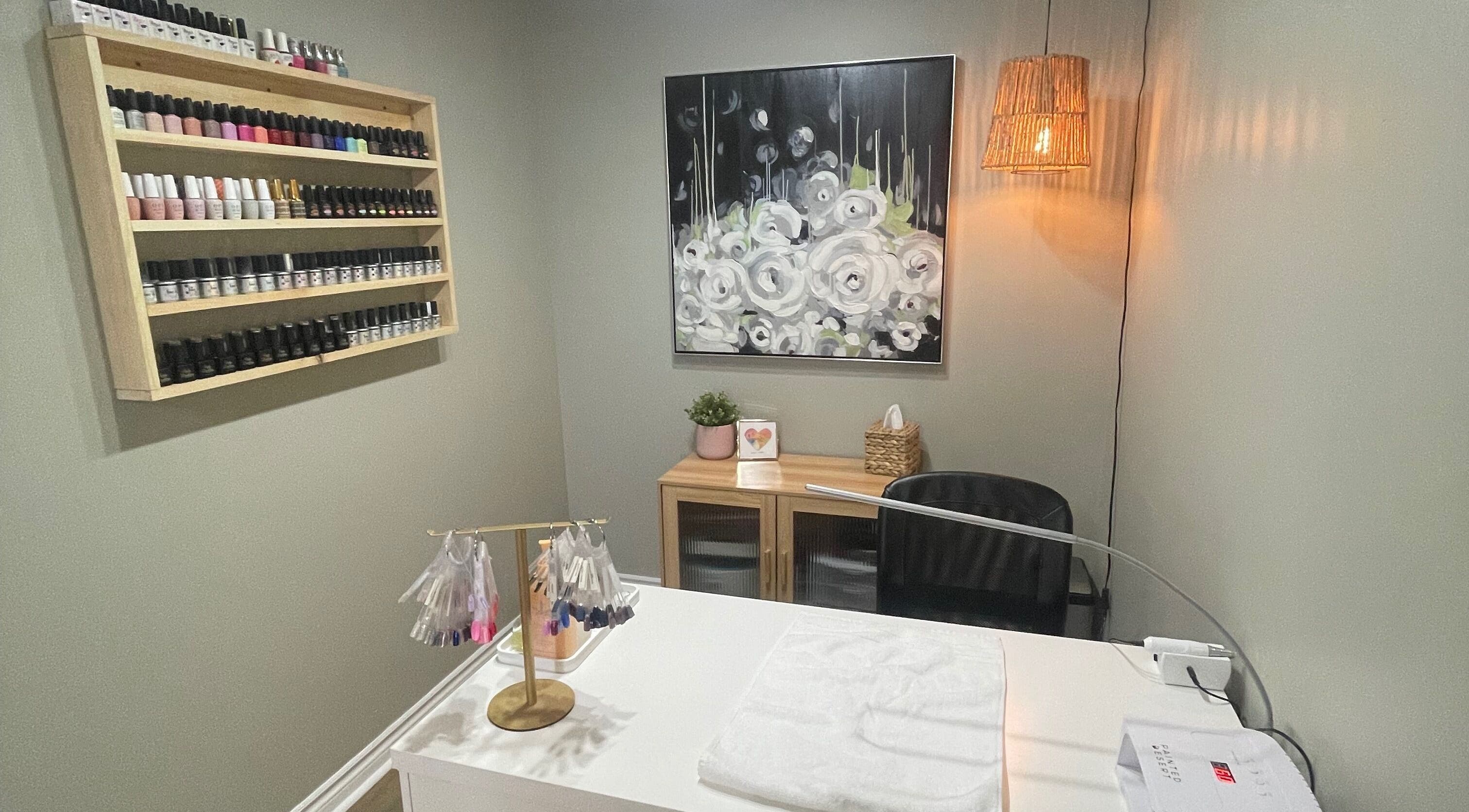 Nail salon at Chelseas Esthetics in Sydney Mines, Nova Scotia, CA featuring polish display and modern décor.