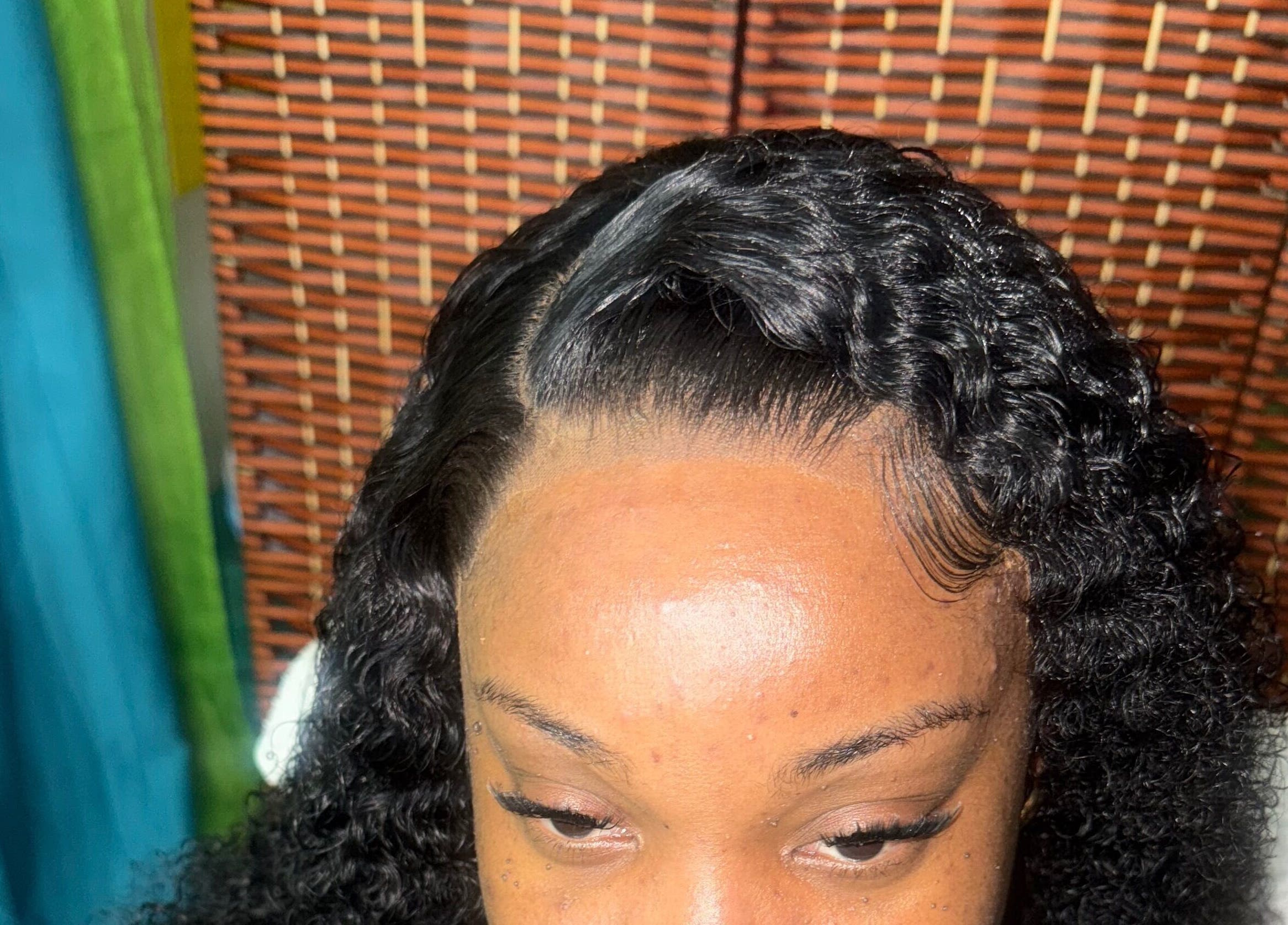 Close-up of styled curly hair at GLOWED BY TAMMY, Roseau, Saint George Parish, DM.