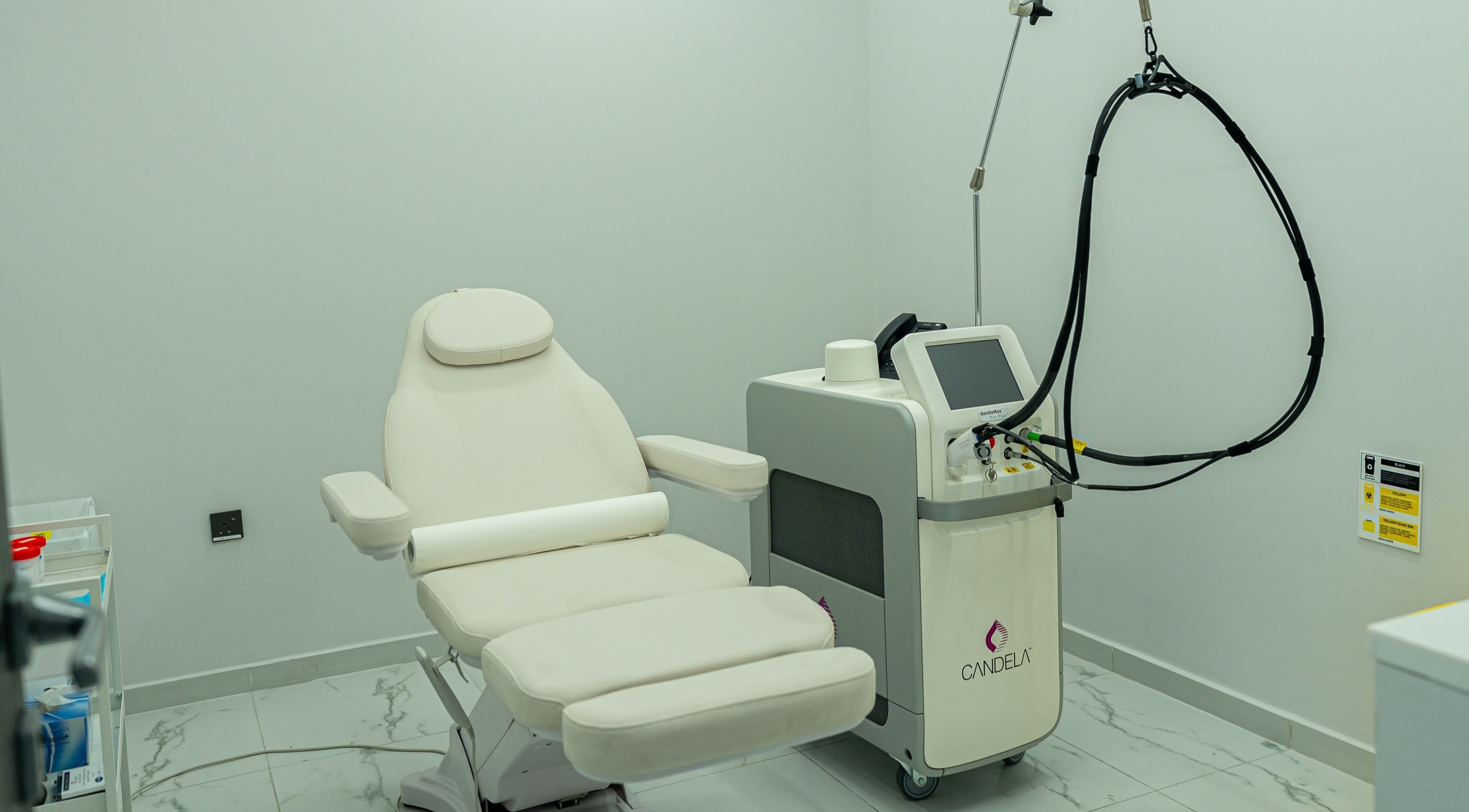 Modern treatment room at Boulevard Clinic, Doha, Doha Municipality, QA, showcasing advanced aesthetic equipment.