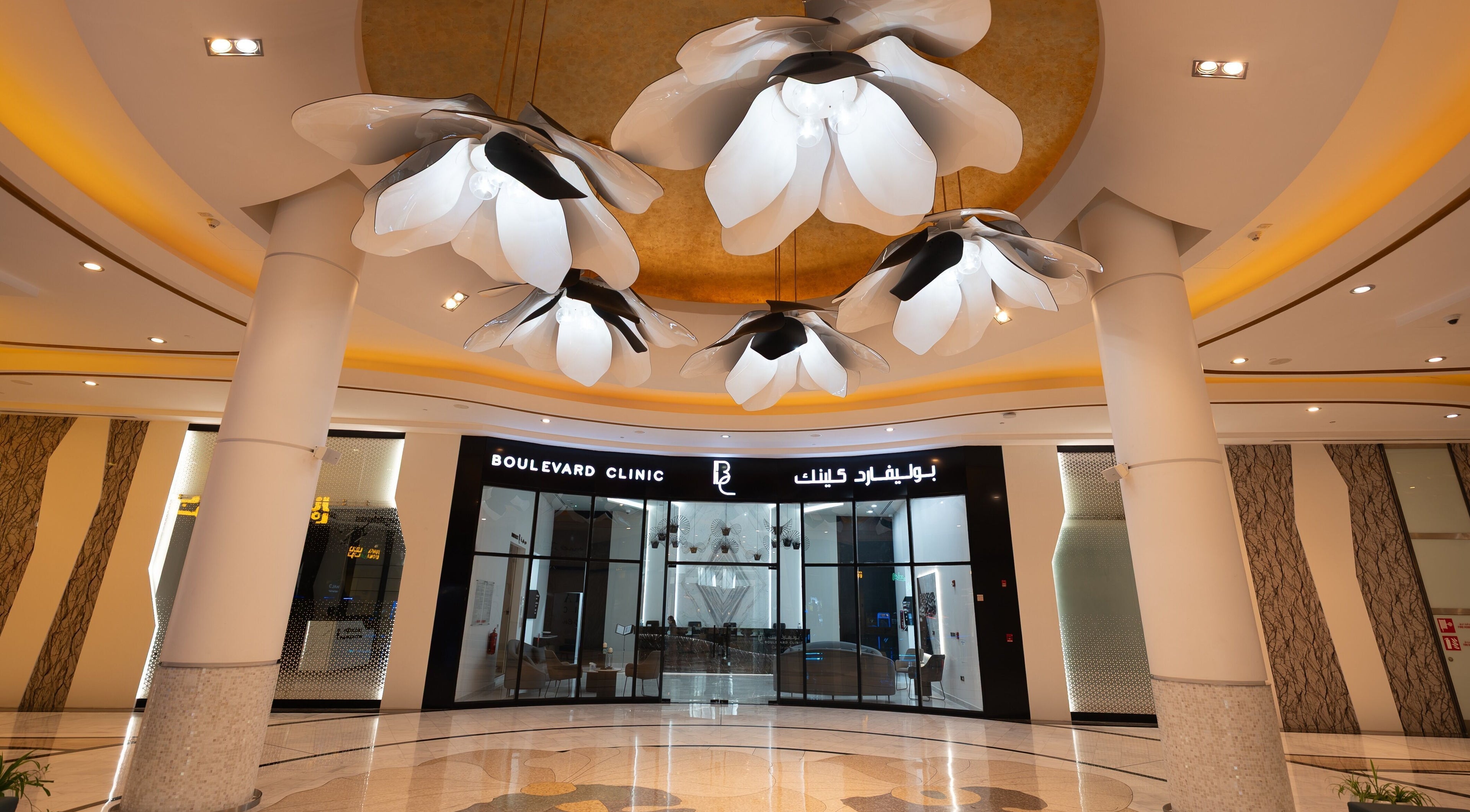 Elegant entrance of Boulevard Clinic in Doha, Doha Municipality, QA with modern lighting fixtures.