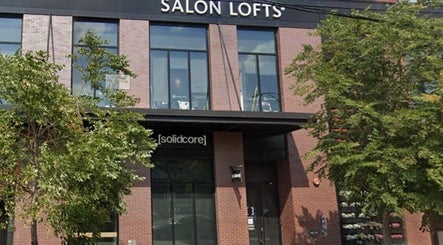 Exterior of Glow With Lindsay's wellness center in Chicago, Illinois, US, featuring sleek architecture and lush greenery.