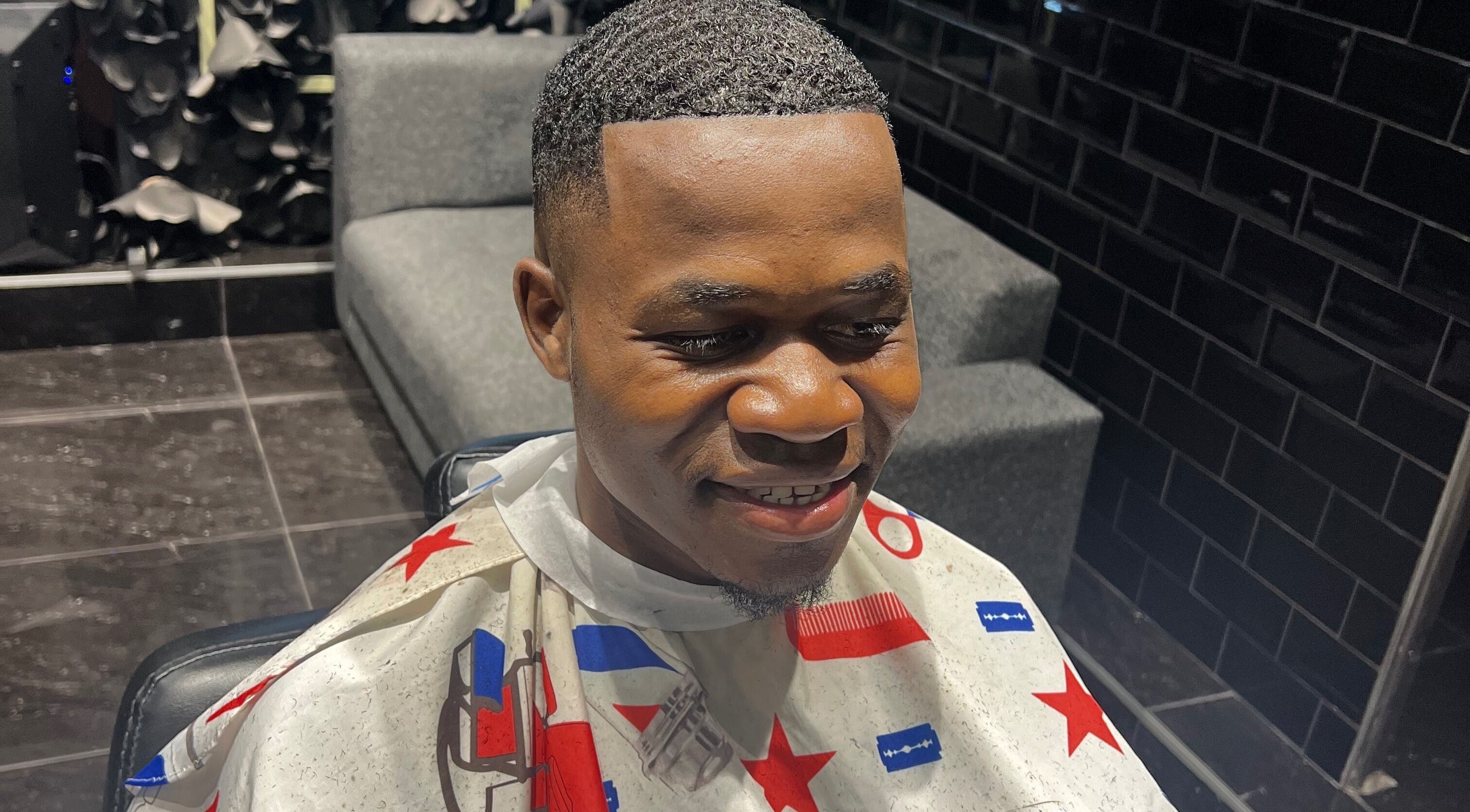 A fresh haircut at JOSHUA BARBER Cape Town, Western Cape, ZA shows expert styling in a sleek barbershop setting.