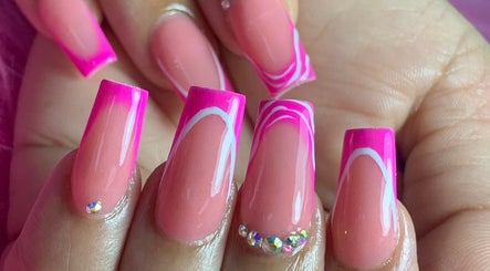 Elegant pink acrylic nails with rhinestones at A Touch Of Elegance, Couva, Couva-tabaquite-talparo Regional Corporation, TT.