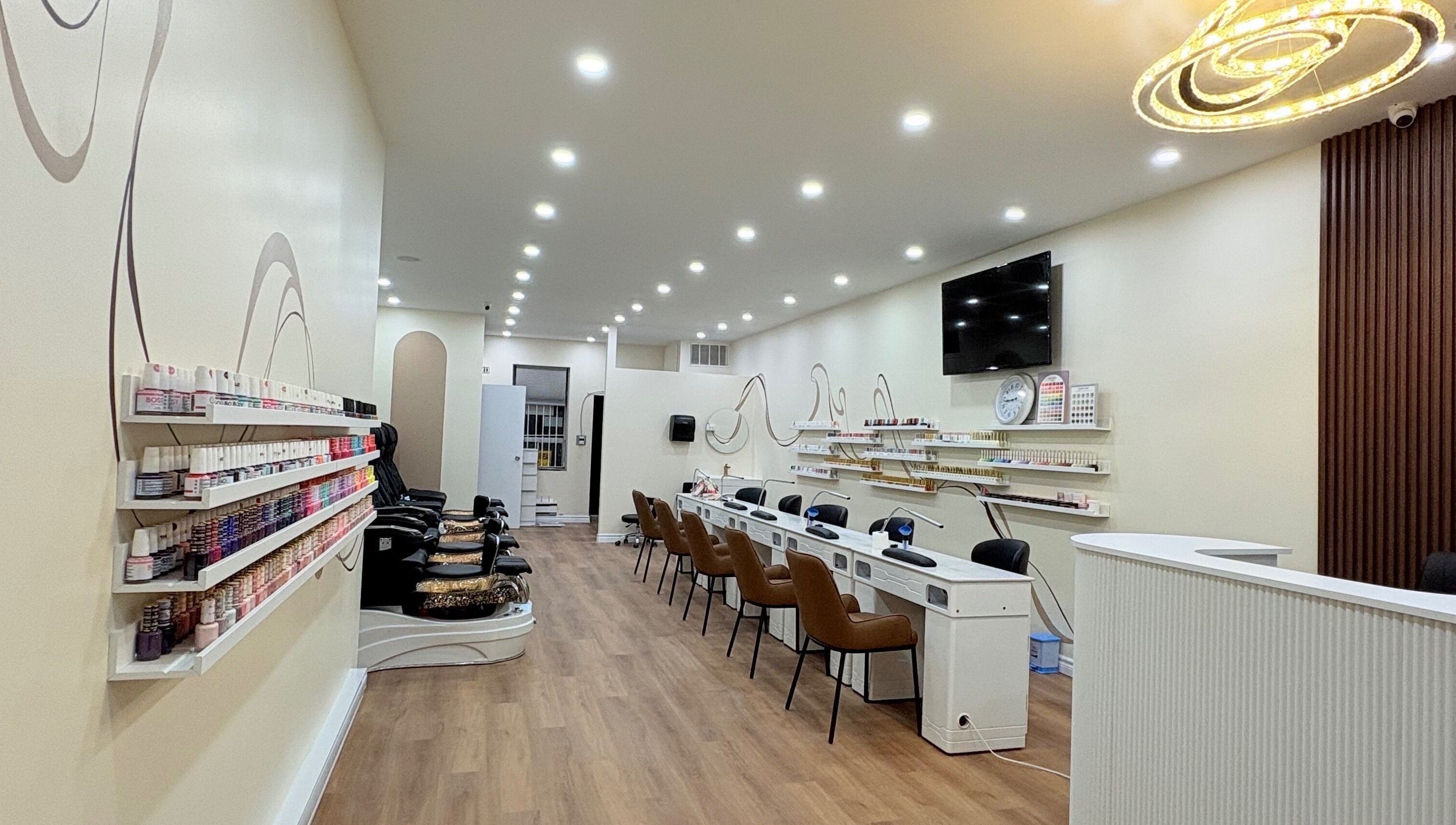 Spacious interior of Nail Haus, Toronto, Ontario, CA, showcasing modern decor and comfortable seating.