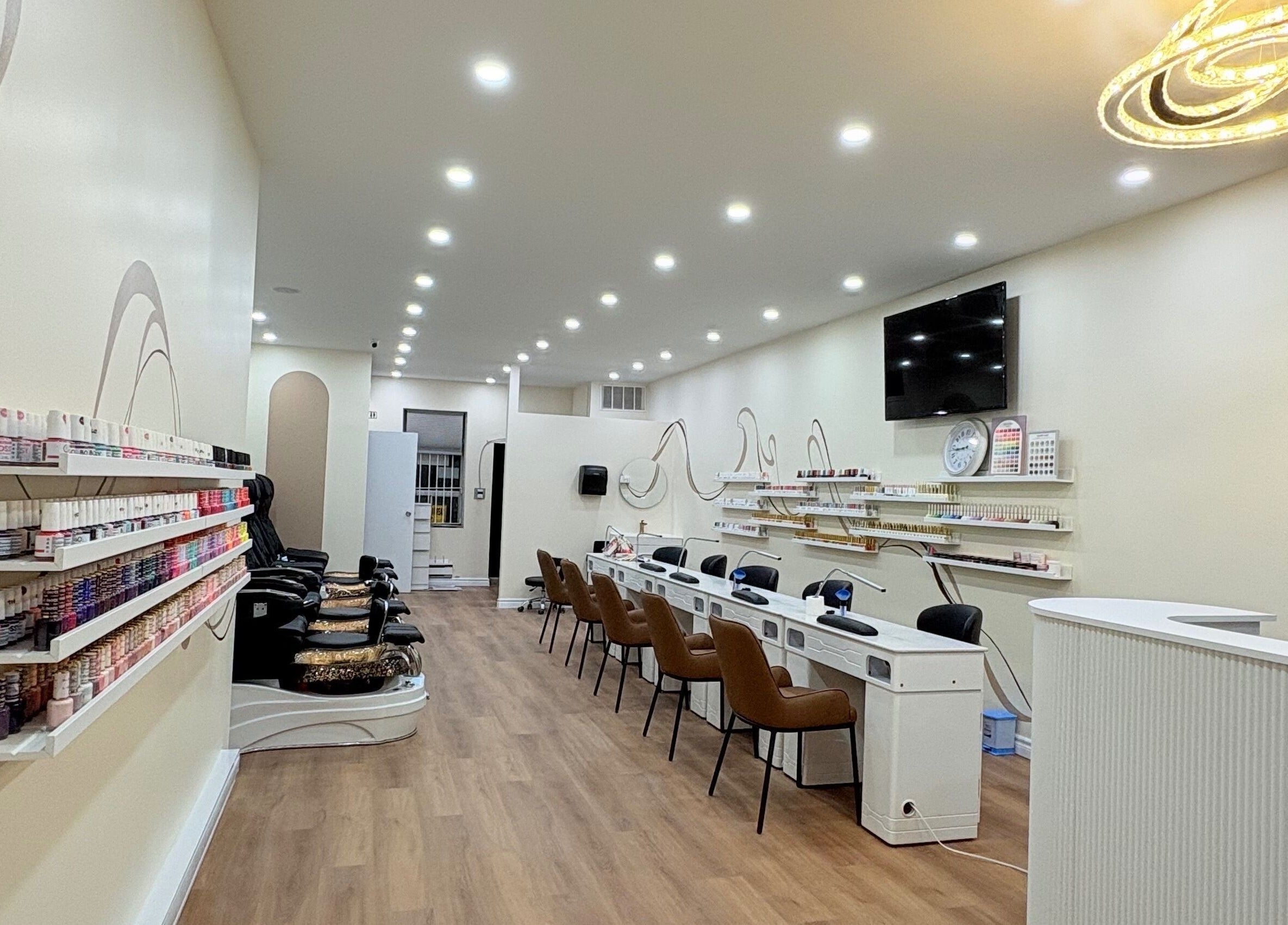 Spacious interior of Nail Haus, Toronto, Ontario, CA, showcasing modern decor and comfortable seating.