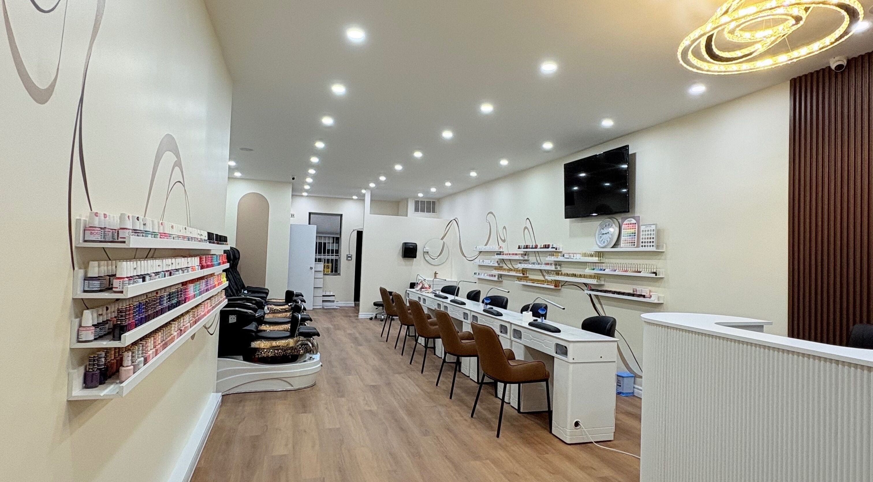 Spacious interior of Nail Haus, Toronto, Ontario, CA, showcasing modern decor and comfortable seating.