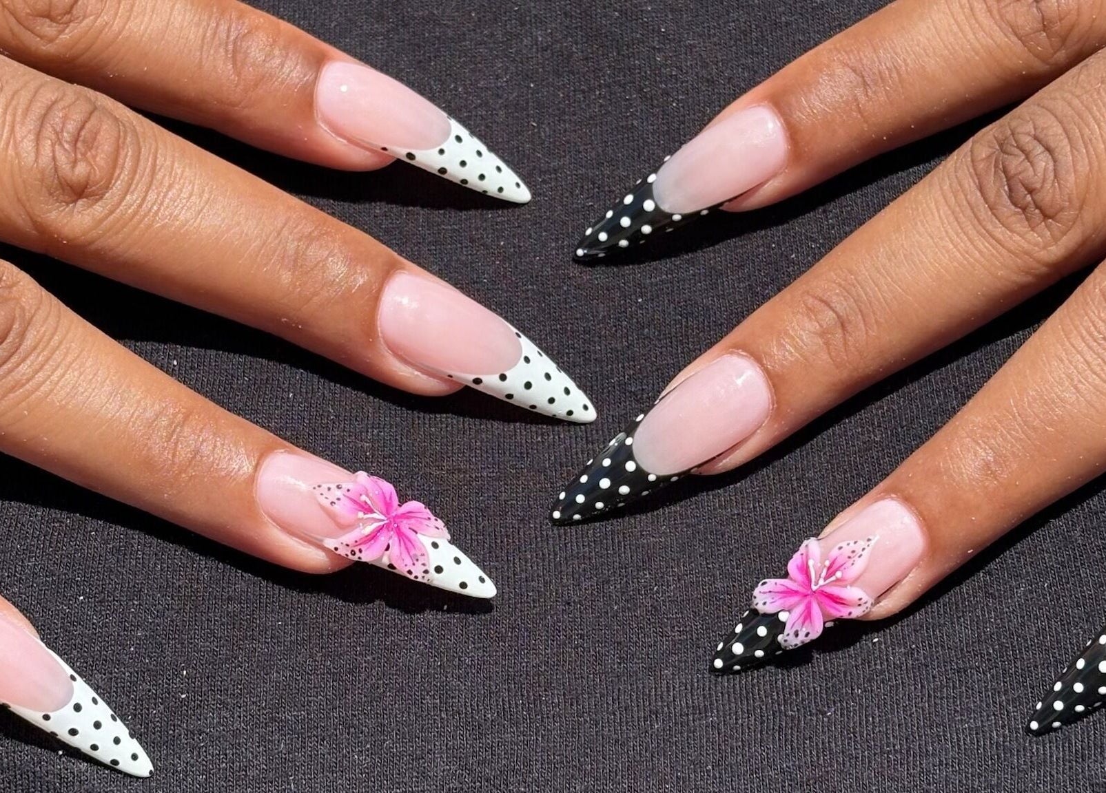 Stunning polka-dot nails with floral accents at Nail Haus, Toronto, Ontario, CA.