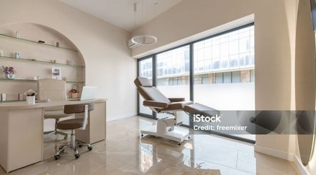 Modern treatment room at House of S, Langemark-poelkapelle, Vlaanderen, BE. Features plush chair and sleek desk.