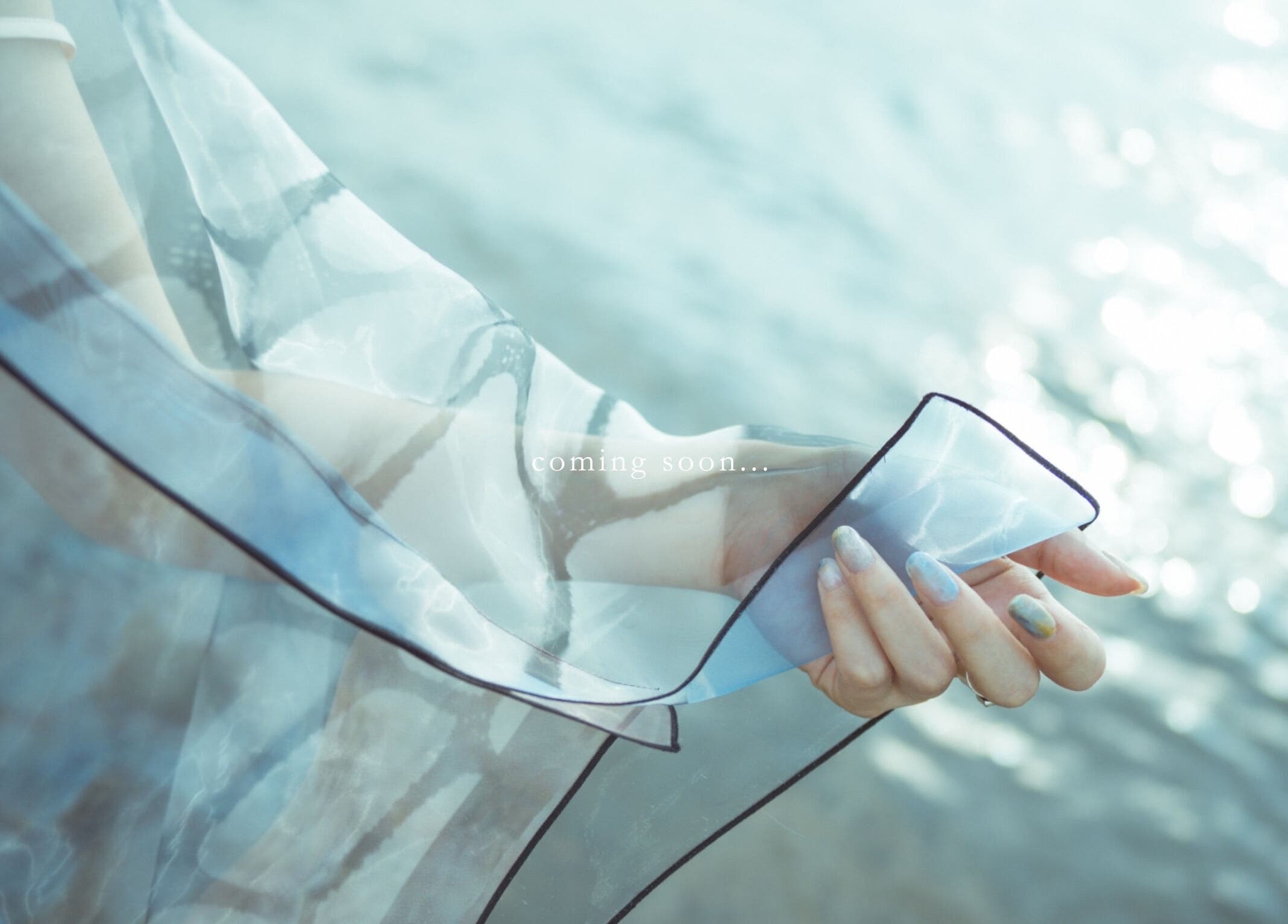 Elegant hand with sheer fabric at SUMU, Düsseldorf, Nordrhein-westfalen, DE.