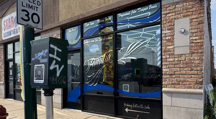 Exterior view of La Familia Barbershop in Chicago, Illinois, highlighting its stylish storefront signage.
