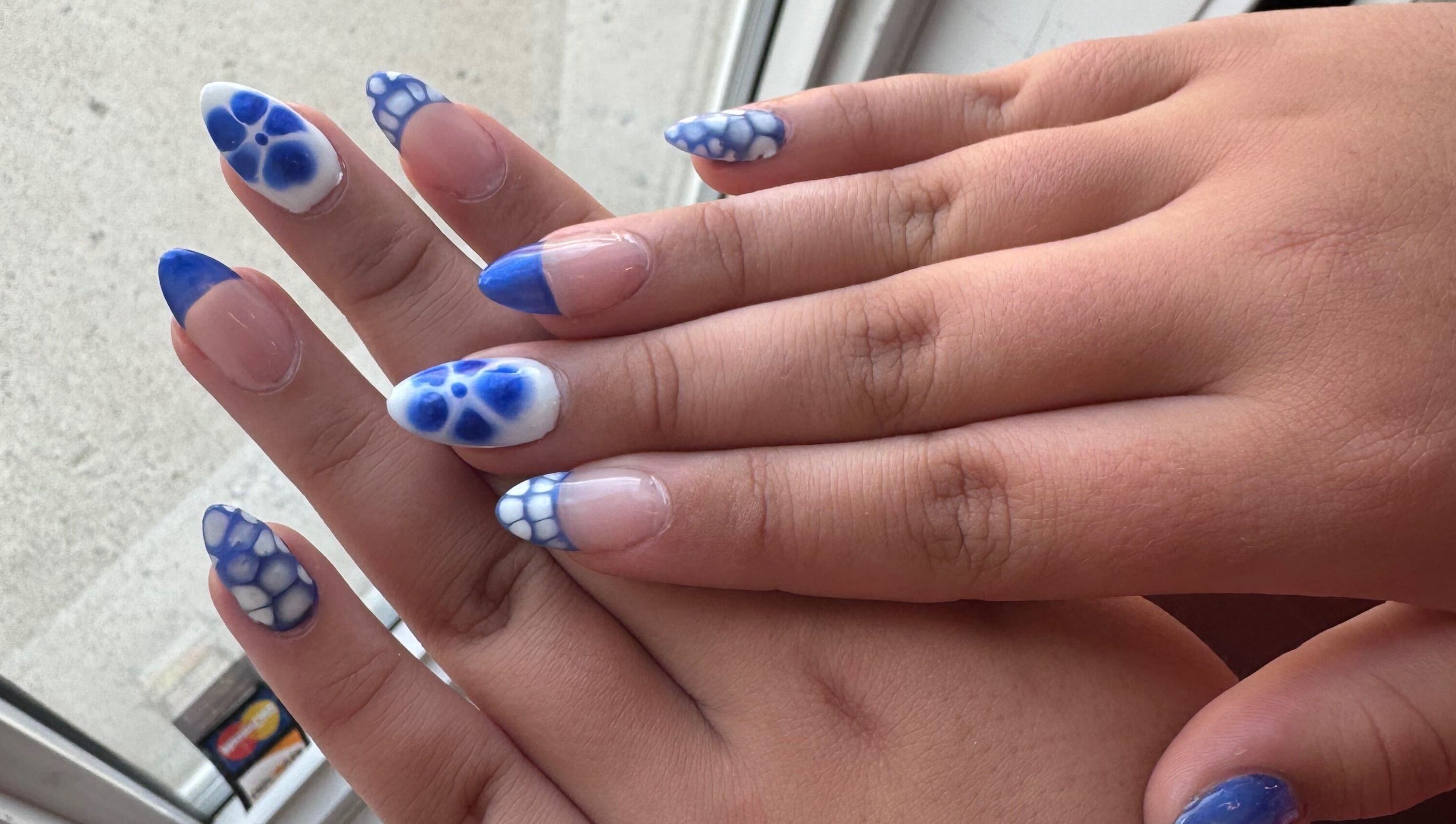 Stylish blue and white nail art at H + E By Jayla P, Weyburn, Saskatchewan, CA.