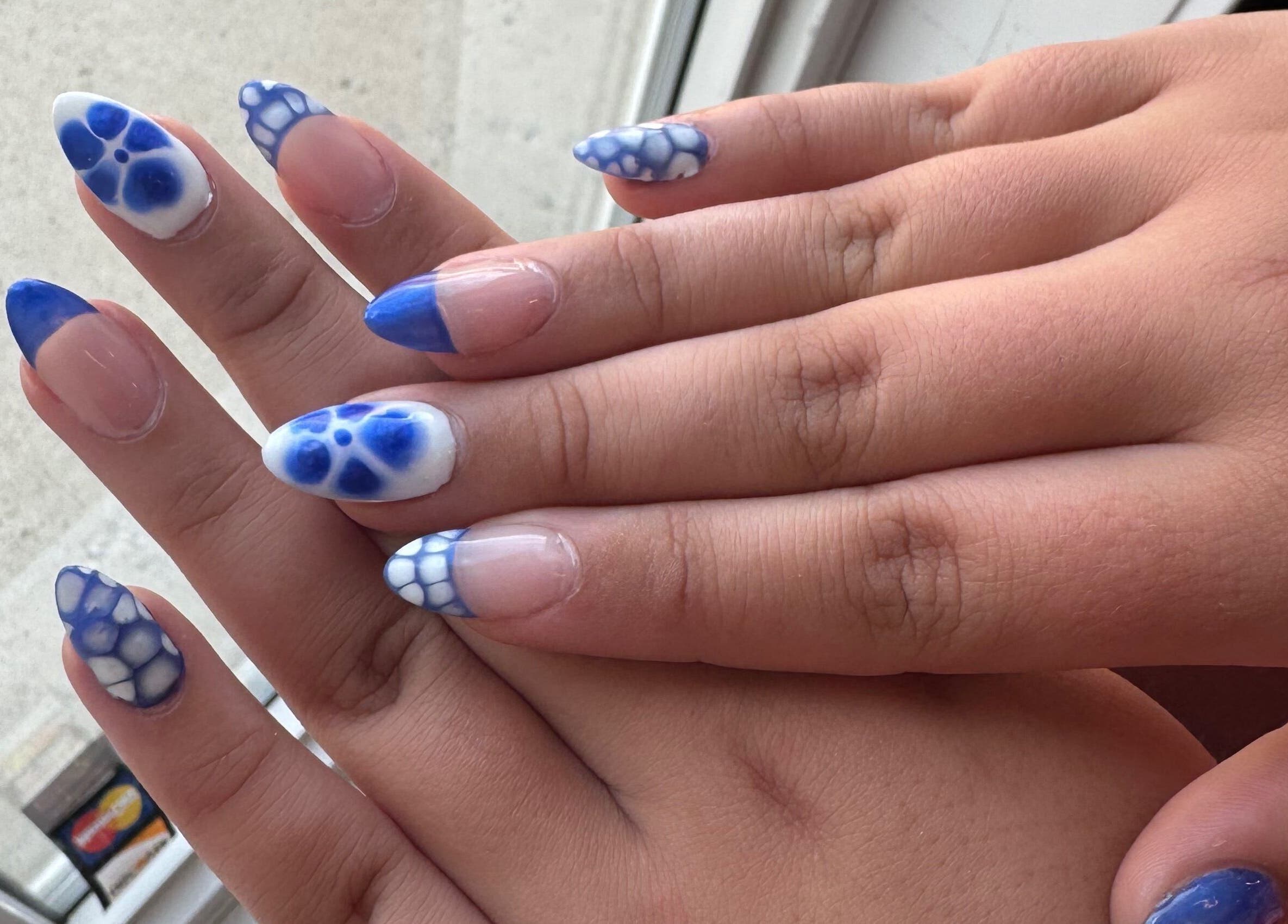 Stylish blue and white nail art at H + E By Jayla P, Weyburn, Saskatchewan, CA.
