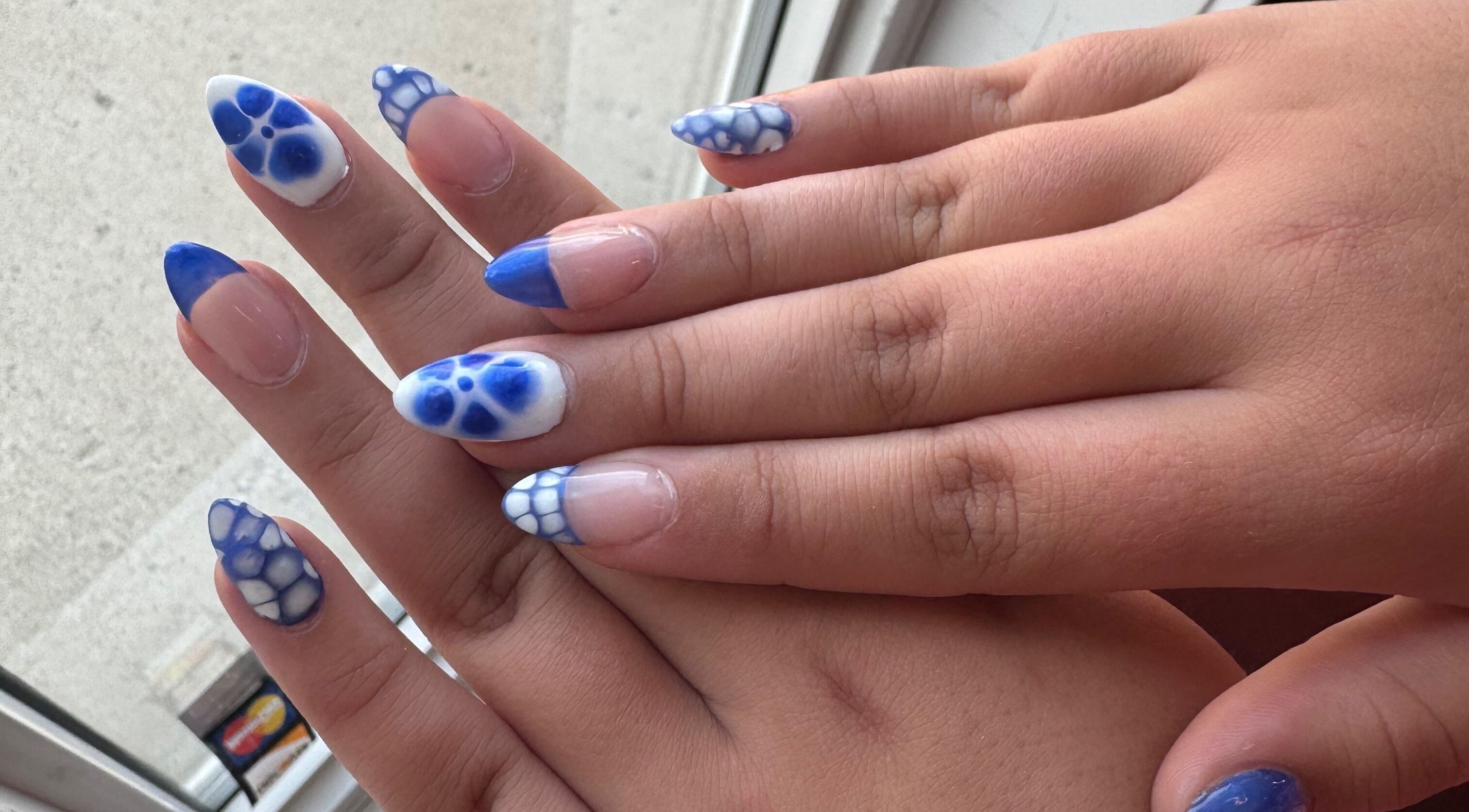 Stylish blue and white nail art at H + E By Jayla P, Weyburn, Saskatchewan, CA.