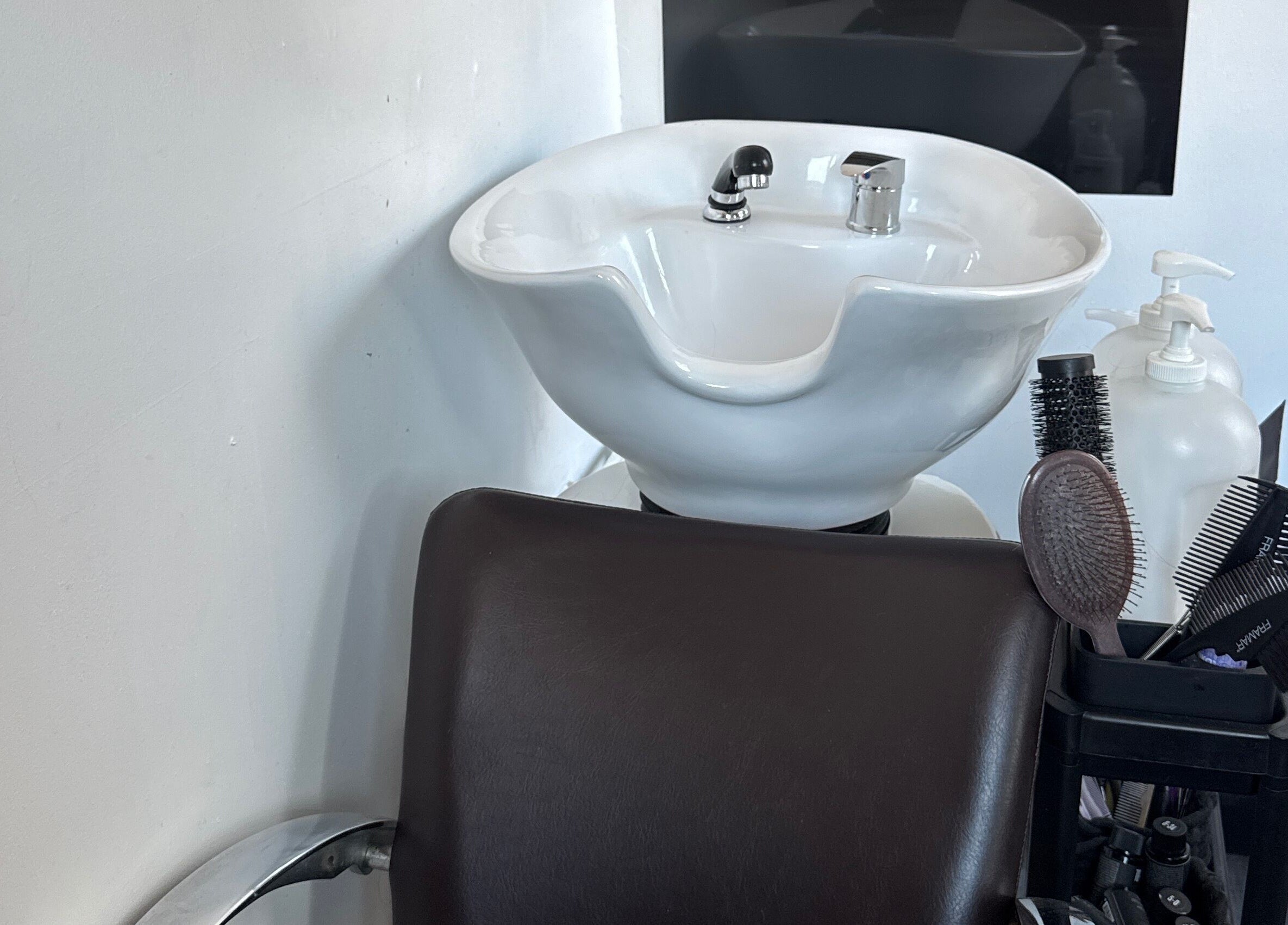 Hair wash station at Flodrieshairstudio, Temple Cloud, England, GB, featuring a sink and tools.