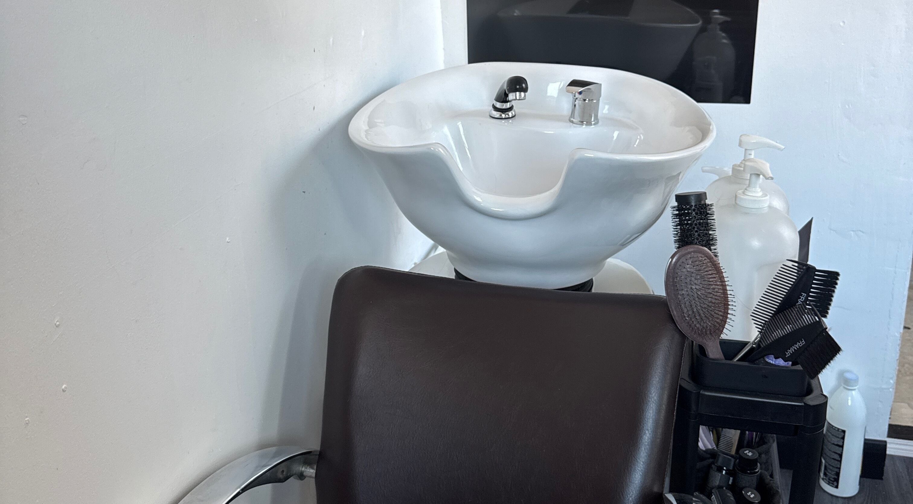 Hair wash station at Flodrieshairstudio, Temple Cloud, England, GB, featuring a sink and tools.