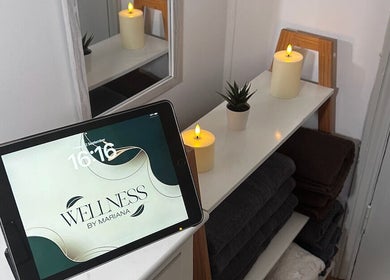Cozy interior of Wellness by Mariana with candles and towels in Southampton, England, GB.