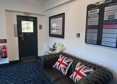 Welcoming seating at Wellness by Mariana, Southampton, England, GB with Union Jack pillows and cozy décor.