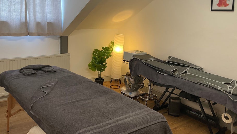 Cozy massage room at Wellness by Mariana, Southampton, England, GB. Warm lighting and relaxing atmosphere.
