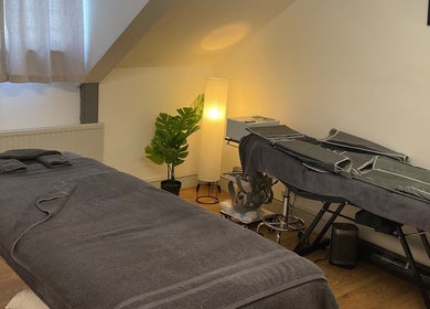 Cozy massage room at Wellness by Mariana, Southampton, England, GB. Warm lighting and relaxing atmosphere.