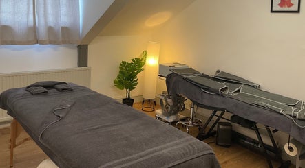 Cozy massage room at Wellness by Mariana, Southampton, England, GB. Warm lighting and relaxing atmosphere.