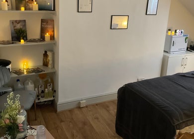 Tranquil treatment room at Wellness by Mariana, Southampton, England, GB, featuring ambient lighting and decor.