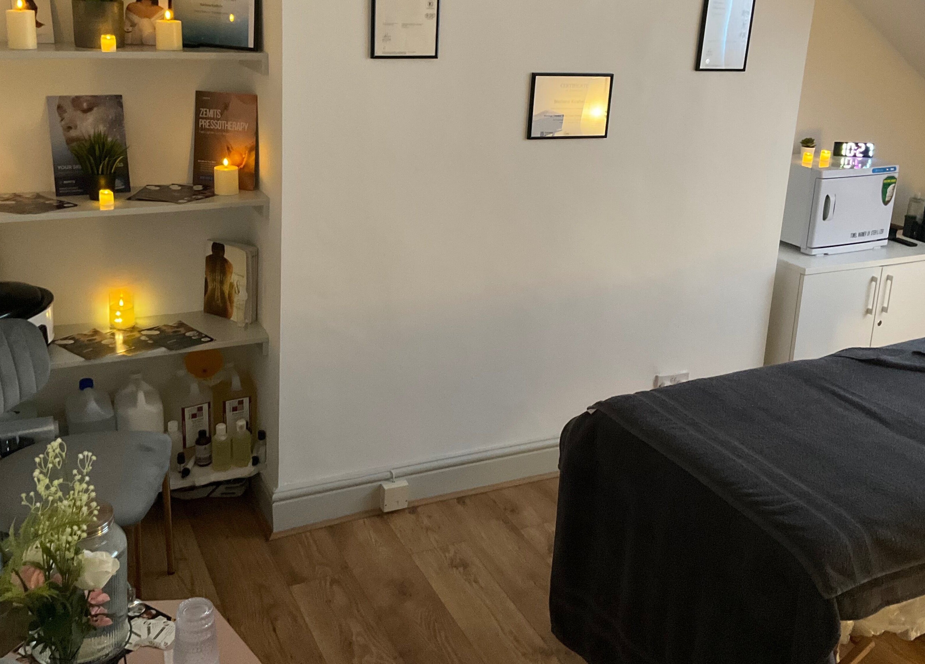 Cozy wellness treatment room at Wellness by Mariana, Southampton, England, GB, adorned with candles and soft lighting.