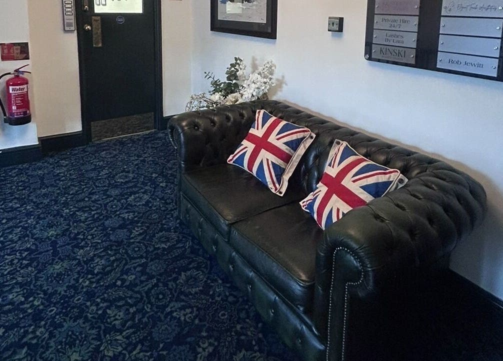 Elegant leather sofa with British pillows at Wellness by Mariana, Southampton, England, GB.