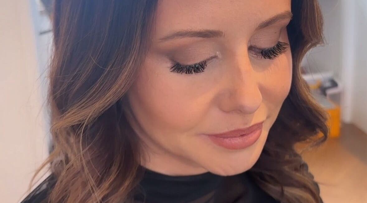 Woman with elegant makeup showcasing eyelash extensions at Sienna Skye Beauty, Kiama Downs, New South Wales, AU.