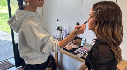 Makeup artist perfecting a look at Sienna Skye Beauty, Kiama Downs, New South Wales, AU.