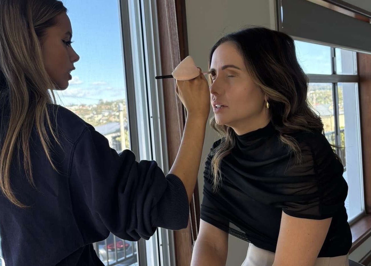 Makeup artist working on client at Sienna Skye Beauty, Kiama Downs, New South Wales, AU.