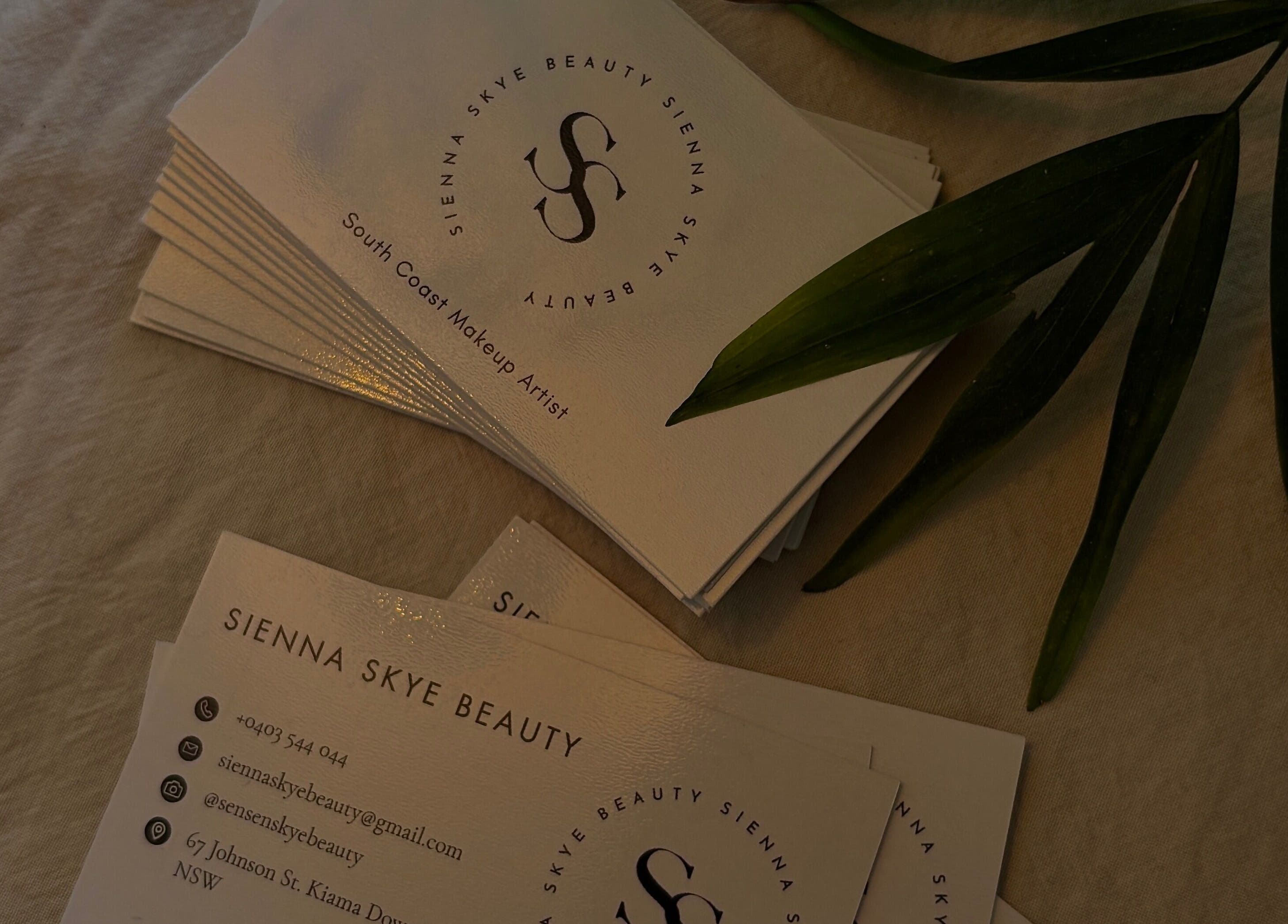 Sienna Skye Beauty business cards on display, highlighting their Kiama Downs, NSW address.