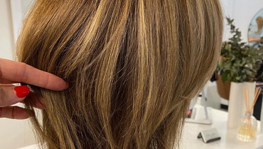 Close-up of highlighted hair styled at Hair Junkie, Toowoon Bay, New South Wales, AU enhancing modern beauty.
