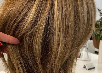 Close-up of highlighted hair styled at Hair Junkie, Toowoon Bay, New South Wales, AU enhancing modern beauty.