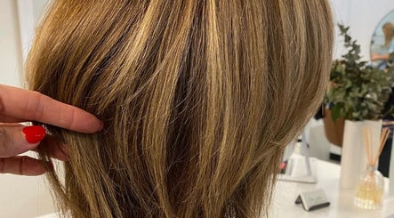 Close-up of highlighted hair styled at Hair Junkie, Toowoon Bay, New South Wales, AU enhancing modern beauty.