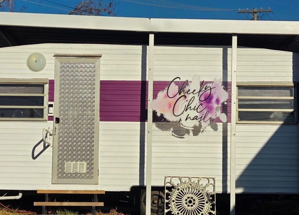Entrance of Cheeky Chic Nails at Emu Plains, New South Wales, AU, featuring a stylish caravan design.