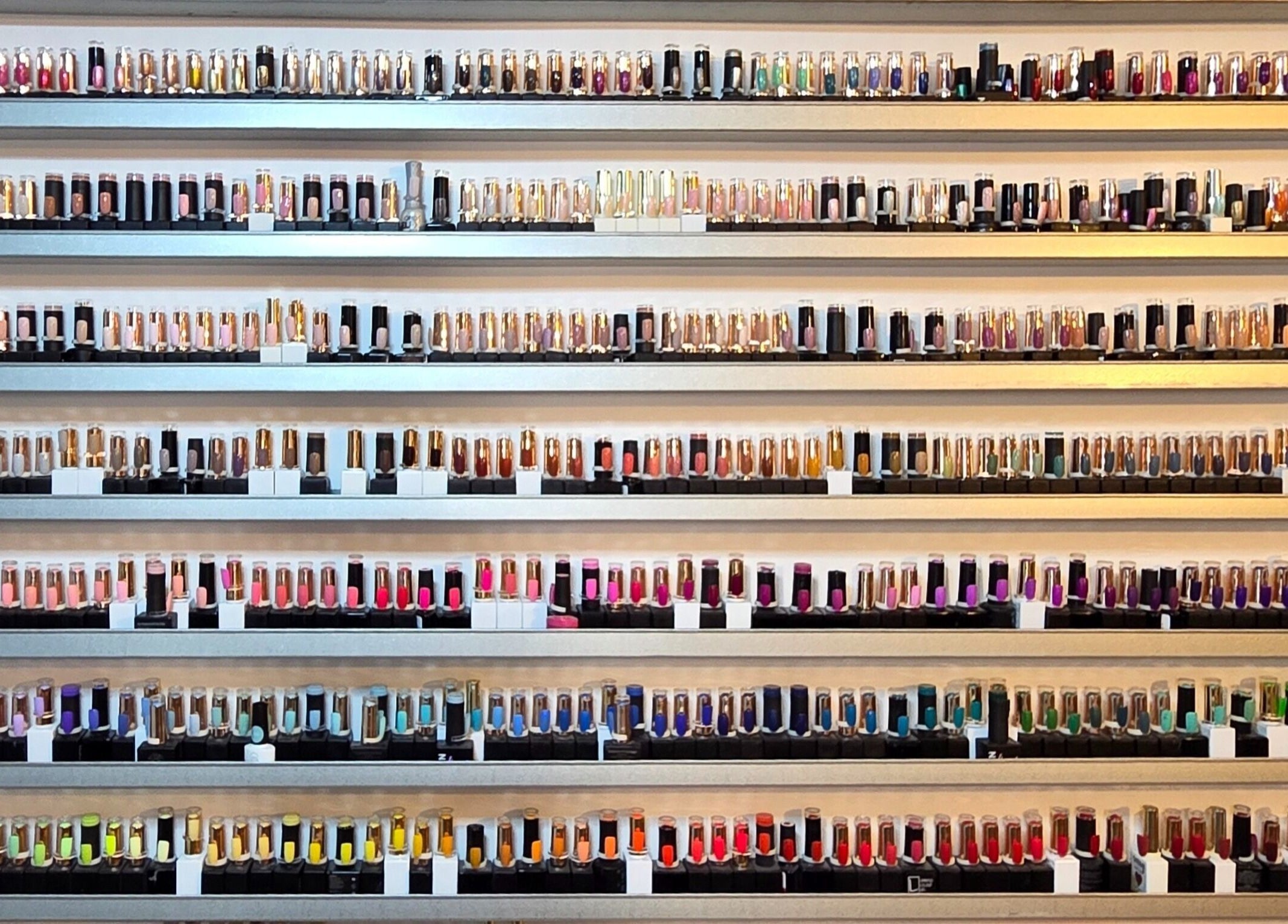Colorful nail polish collection at Cheeky Chic Nails, Emu Plains, New South Wales, AU.