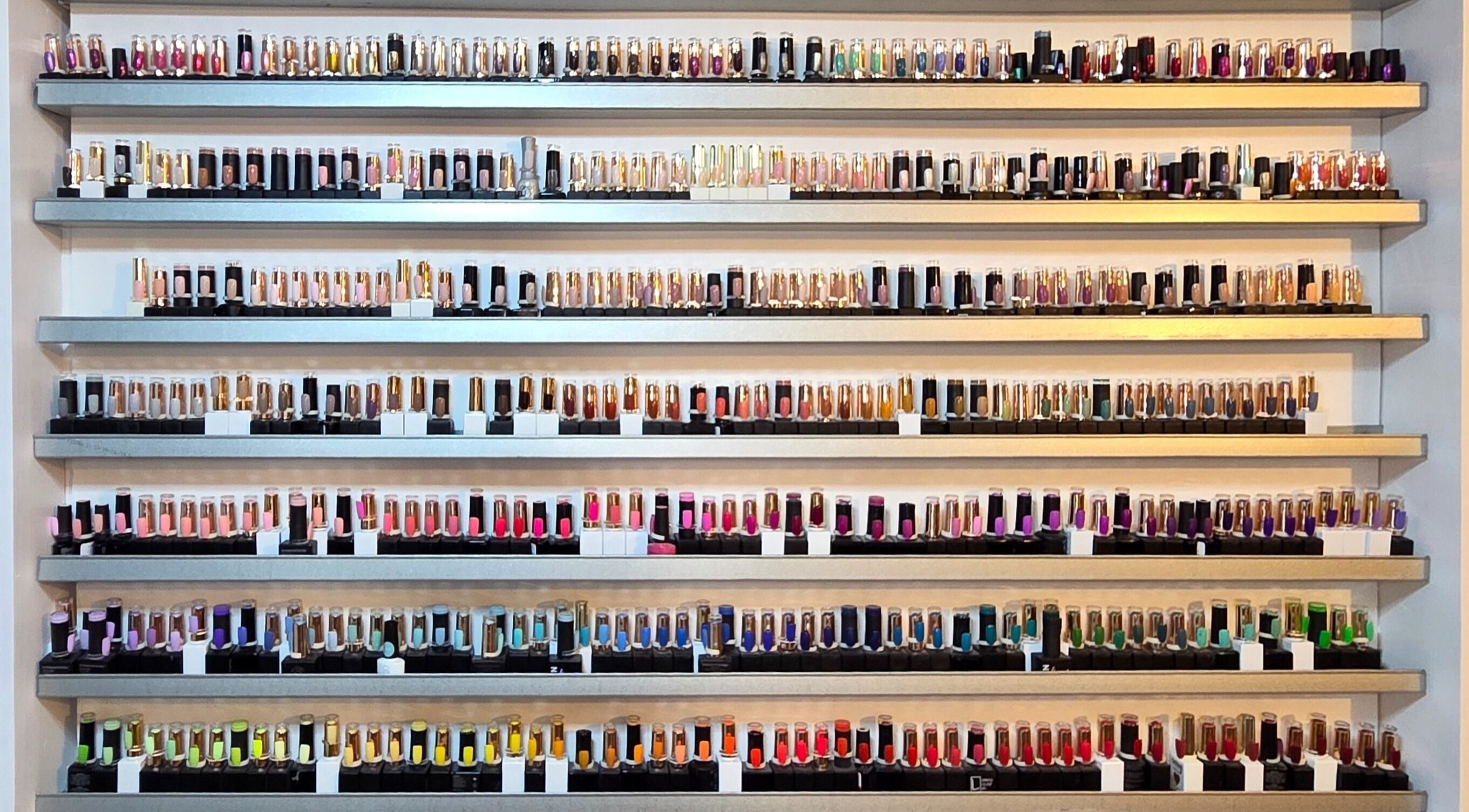 Colorful nail polish collection at Cheeky Chic Nails, Emu Plains, New South Wales, AU.