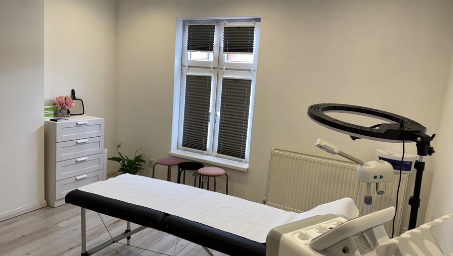 Bright treatment room at my.wax.lab in Long Eaton, England, GB with massage table and modern decor.