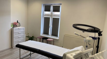 Bright treatment room at my.wax.lab in Long Eaton, England, GB with massage table and modern decor.