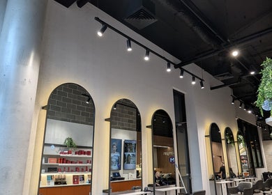 Interior of Bibi Beauty, Erskineville, New South Wales, AU with stylish mirrors and elegant lighting.