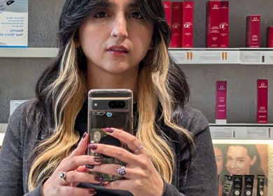 Customer at Bibi Beauty in Erskineville, New South Wales, AU taking selfie with product shelves in background.