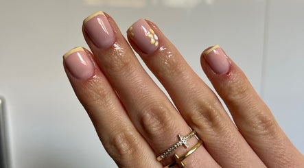 Manicured hand with nail art at Bialana, Ramsgate Beach, New South Wales, AU.